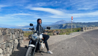 girl on motobike with teide in background