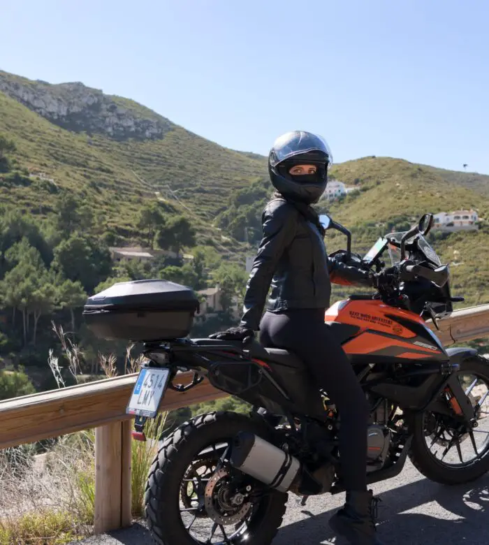 girl in motorcycle gear mountain